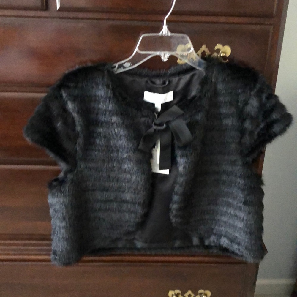 Faux Fur short jacket with ribbon closure.